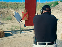 Man shooting with PT Swinger