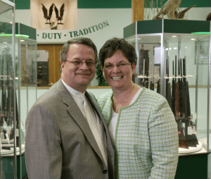 Miles Hall poses with his wife at H&H Shooting Sports in Oklahoma City.