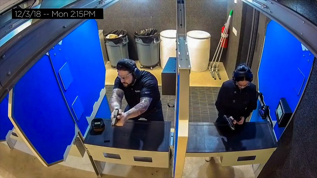 An HD security camera monitoring shooters in a range.