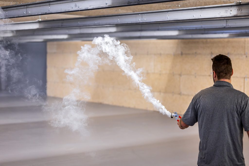Smoke being introduced and cleared by the laminar diffuser in a shooting range