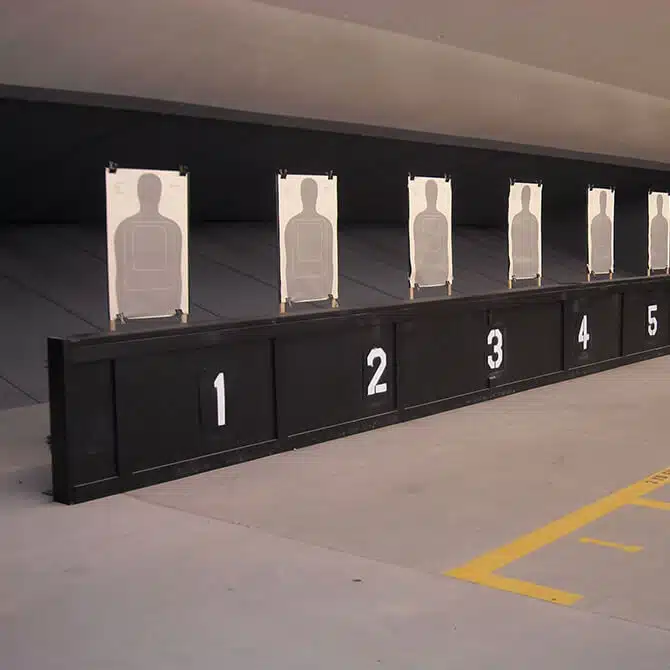 Action Target's knee wall bullet trap with paper targets behind