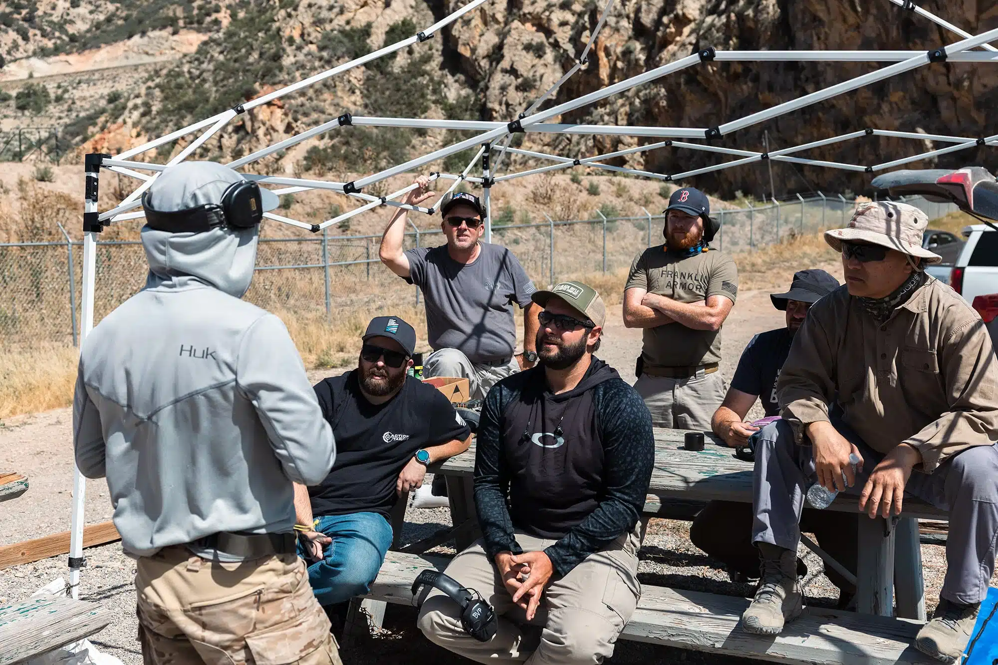 Group of men sitting around an instructor at LETC