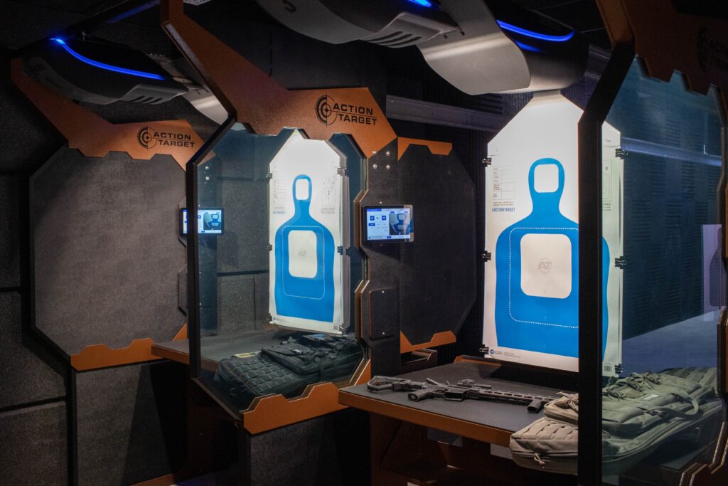 Genesis retrievers with targets and Defender stalls at indoor home gun range