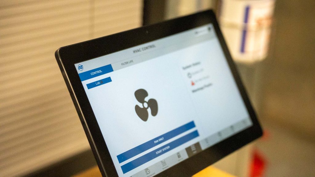 Tablet on table with HVAC dashboard on screen